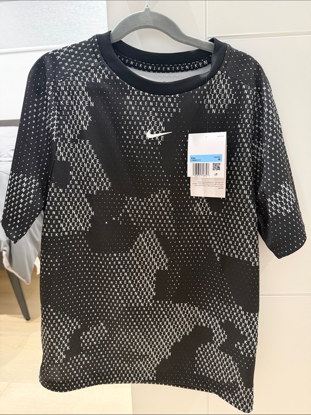 Nike Black and White All‑Over Logo Pattern Tee